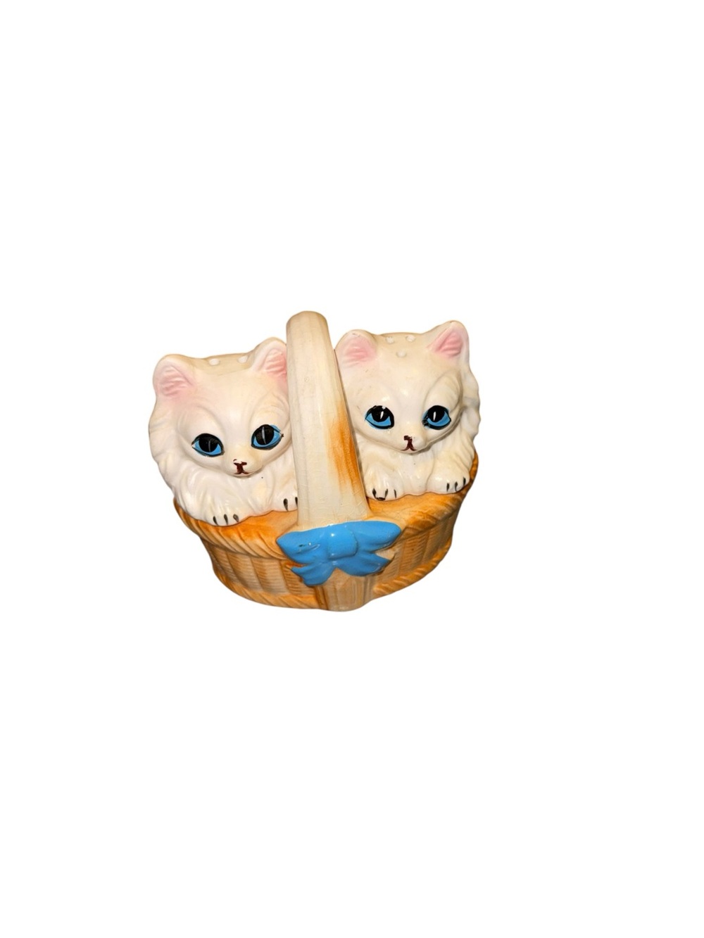 Vintage white kitty shakers in basket